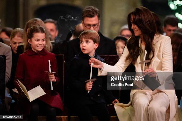 Princess Charlotte, Prince Louis and Catherine, Princess of Wales during the Royal Carols - Together At Christmas service at Westminster Abbey on...