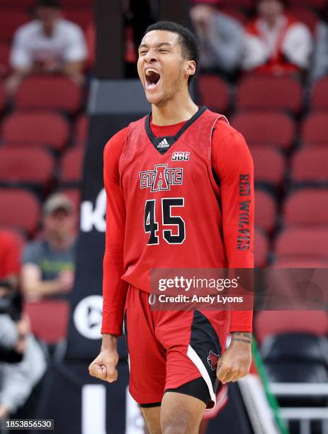 Dyandre Dominguez of the Arkansas State Red Wolves celebrates in the 75-63 win against the Louisville Cardinals at KFC YUM! Center on December 13,...