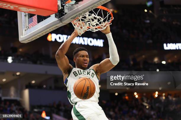 Giannis Antetokounmpo of the Milwaukee Bucks dunks against the Indiana Pacers during the second half of a game at Fiserv Forum on December 13, 2023...