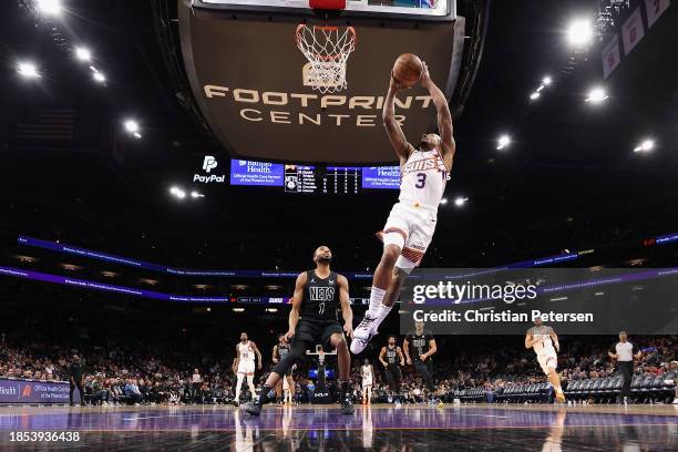 Bradley Beal of the Phoenix Suns puts up a shot ahead of Mikal Bridges of the Brooklyn Nets during the second half of the NBA game at Footprint...