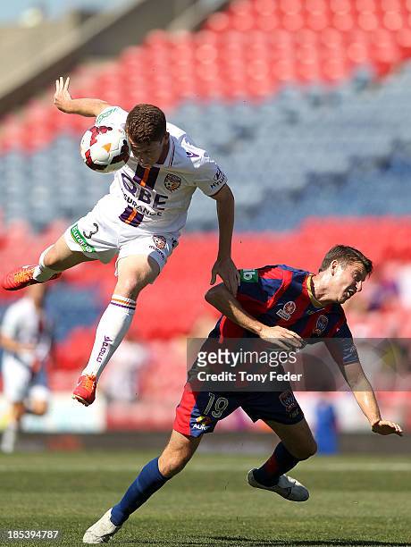 Brandon O'Neill of the Glory heading the ball in front of Michael Bridges of the Jets during the round two A-League match between the Newcastle Jets...