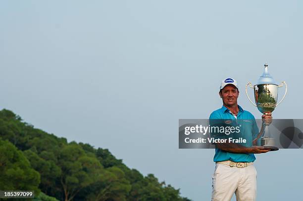 Scott Hend of Australia poses with the trophy after winning the Venetian Macau Open at Macau Golf and Country Club on October 20, 2013 in Macau,...