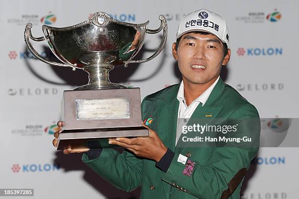 Kang Sung-Hoon of South Korea lifts the winner's trophy during a ceremony following the final round of the 56th Kolon Korea Open 2013 at the Woo...