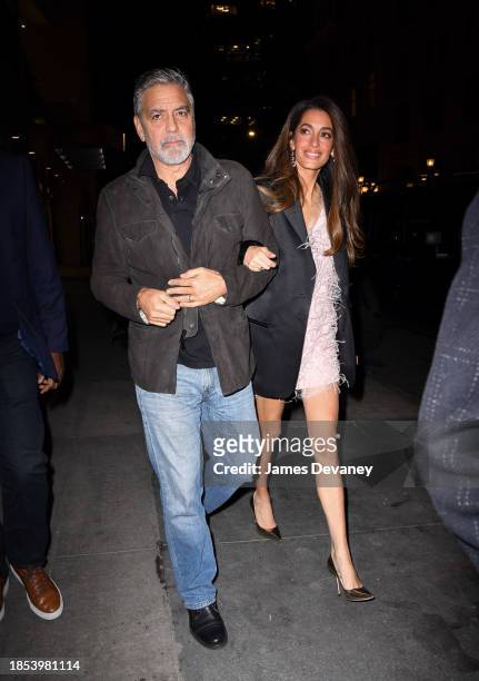 George Clooney and Amal Clooney arrive to the Polo Bar on December 13, 2023 in New York City.