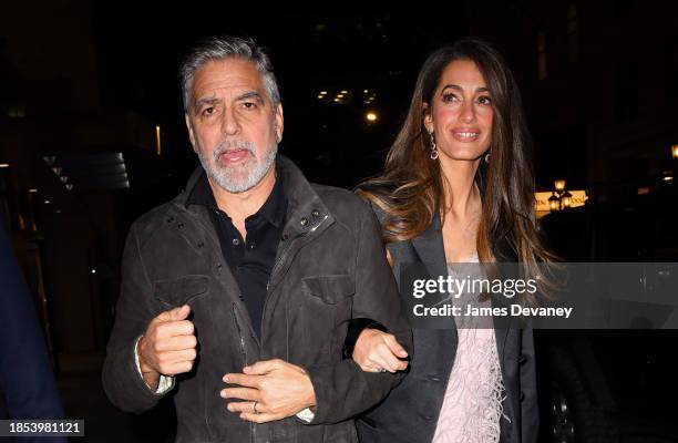 George Clooney and Amal Clooney arrive to the Polo Bar on December 13, 2023 in New York City.