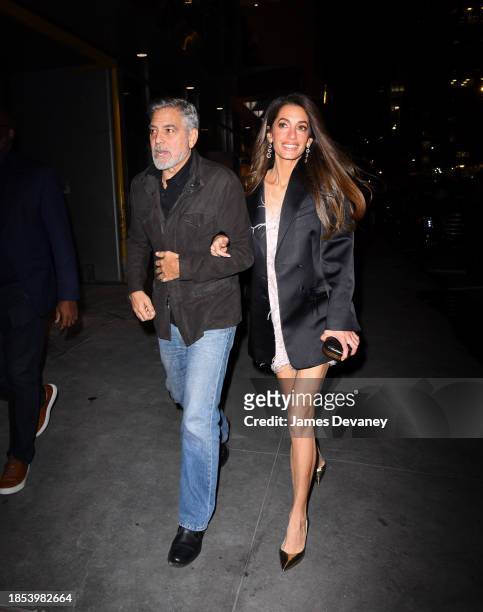 George Clooney and Amal Clooney arrive to the Polo Bar on December 13, 2023 in New York City.