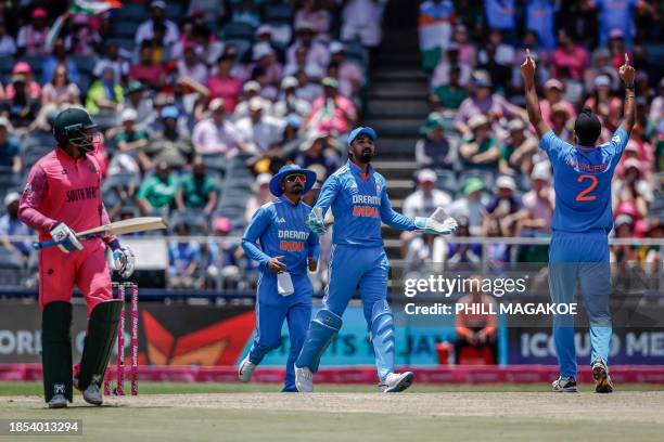 India's Arshdeep Singh celebrates after dismissing South Africa's Andile Phehlukwayo during the 1st ODI cricket match between South Africa and India...