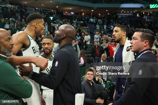 Giannis Antetokounmpo of the Milwaukee Bucks exchanges words with Tyrese Haliburton of the Indiana Pacers following a game at Fiserv Forum on...