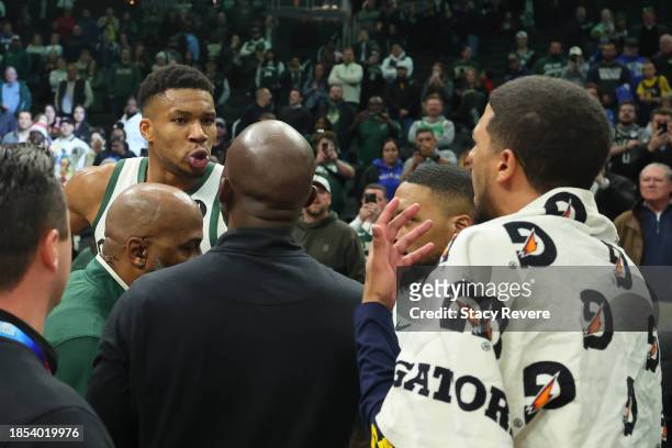 Giannis Antetokounmpo of the Milwaukee Bucks exchanges words with Tyrese Haliburton of the Indiana Pacers following a game at Fiserv Forum on...