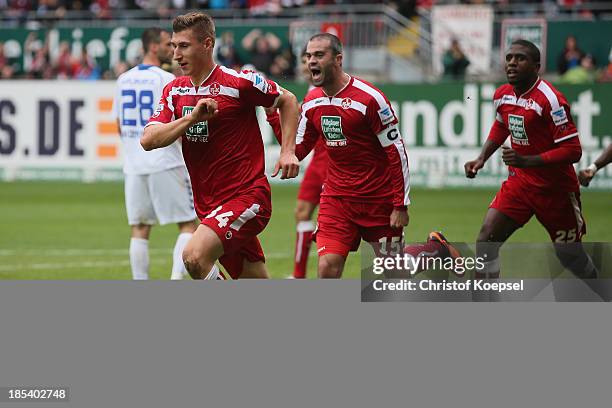 Willi Orban of Kaiserslautern cel2 with Marc Torrejon and Olivier Occean of Kaiserslautern during the the Second Bundesliga match between 1. FC...