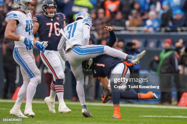 Quarterback Justin Fields of the Chicago Bears looks to deliver an afternoon delight mid-game during an NFL football game against the Detroit Lions...