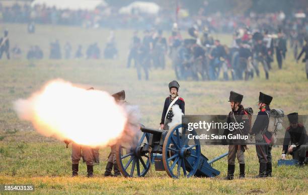 Historical society enthusiasts in the role of Prussian artillery soldiers fire against troops loyal to Napoleon during the re-enactment of The Battle...