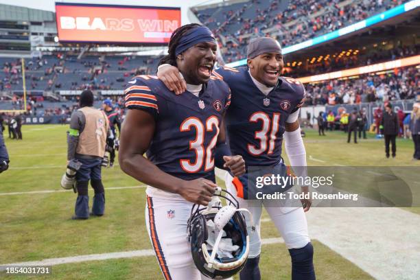 Cornerback Terell Smith and cornerback Jaylon Jones of the Chicago Bears exits the field following a win after an NFL football game against the...
