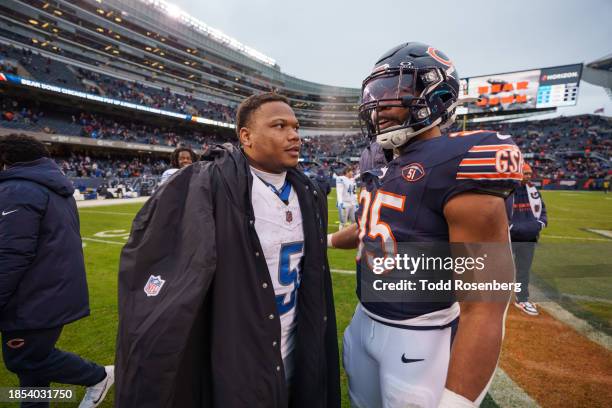 Running back David Montgomery of the Detroit Lions meets defensive end DeMarcus Walker of the Chicago Bears mid-field following an NFL football game...