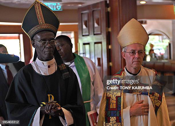 Archbishop of Canterbury Justin Welby stands alongside Archbishop of Kenya Eliud Wabukala on October 20, 2013 during a Sunday mass at the All Saints...