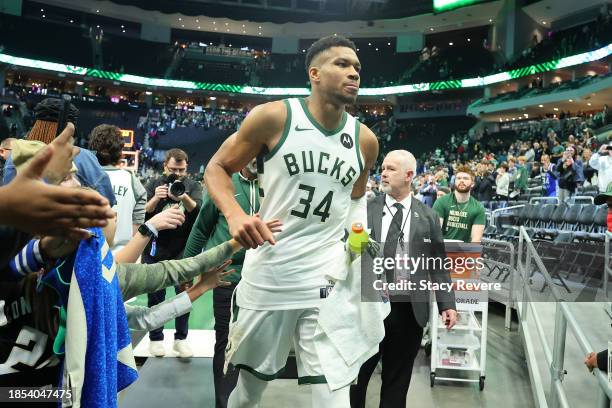 Giannis Antetokounmpo of the Milwaukee Bucks leaves the court following a game against the Indiana Pacers at Fiserv Forum on December 13, 2023 in...