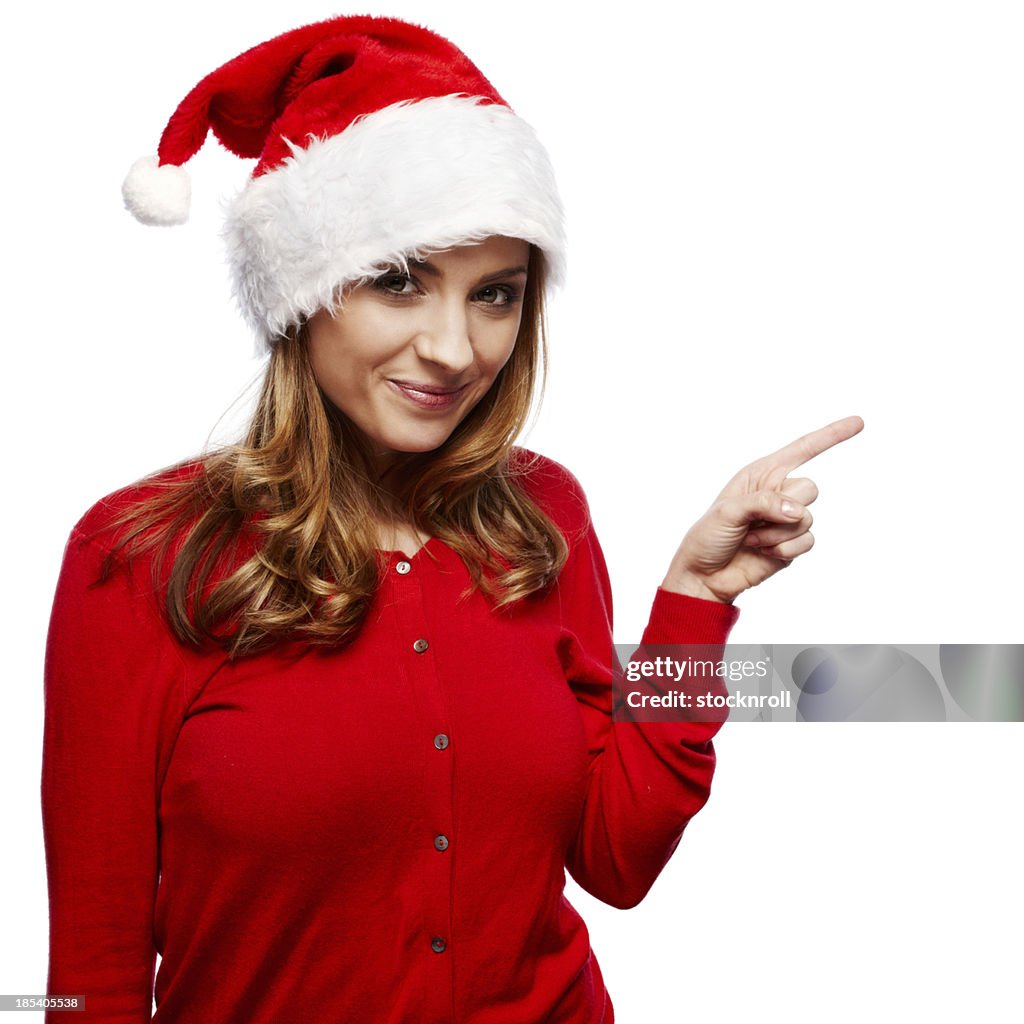 Retrato de una bella mujer joven usando santa hat