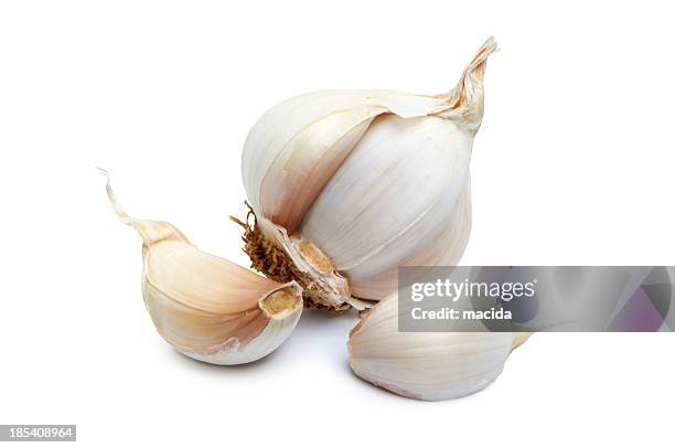 close-up of garlic clove on white background - garlic stock pictures, royalty-free photos & images