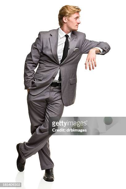 man in suit leans against nothing - leaning stock pictures, royalty-free photos & images