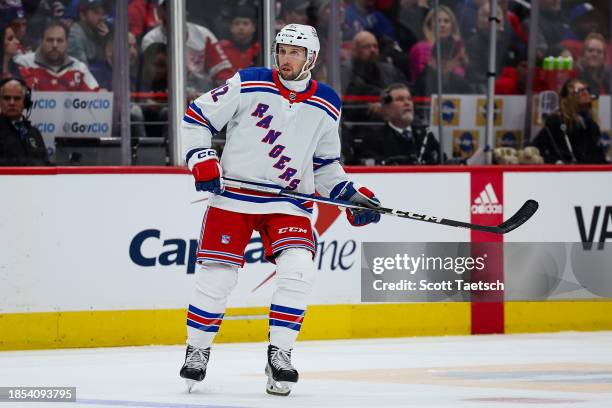 Nick Bonino of the New York Rangers wears a neck guard while skating against the Washington Capitals during the third period of the game at Capital...