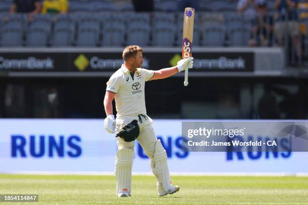 David Warner of Australia celebrates his century during day one of the Men's First Test match between Australia and Pakistan at Optus Stadium on...