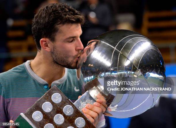 Bulgaria's Grigor Dimitrov kisses the trophy after winning against Spain's David Ferrer in the ATP Stockholm Open tennis tournament final match on...