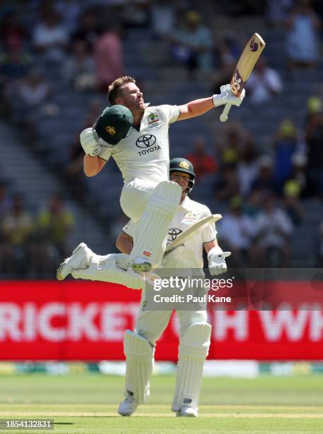 David Warner of Australia celebrates after scoring a century during day one of the Men's First Test match between Australia and Pakistan at Optus...