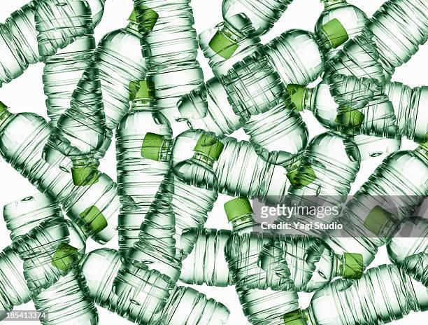 plastic bottles of mineral water - plastikmaterial stock-fotos und bilder