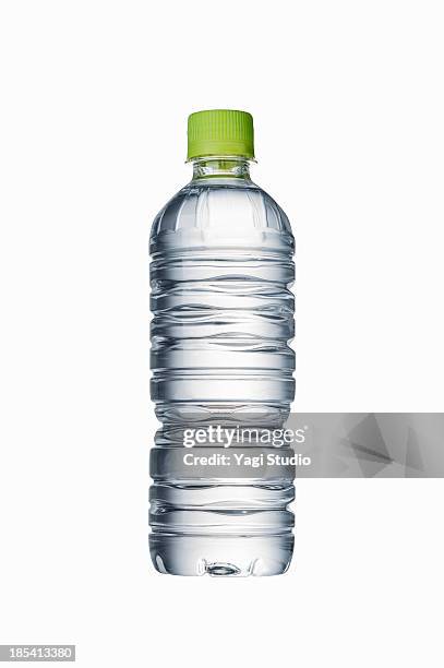 plastic bottle of mineral water - botella de agua fotografías e imágenes de stock