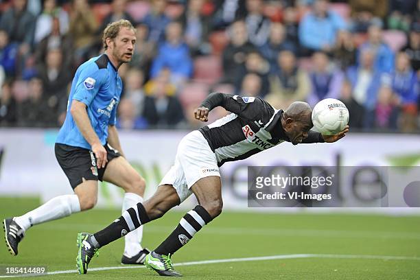 Michel Breuer of NEC, Kwame Quansah of Heracles, during the Eredivisie match between Heracles Almelo and NEC Nijmegen on October 20, 2013 at the...