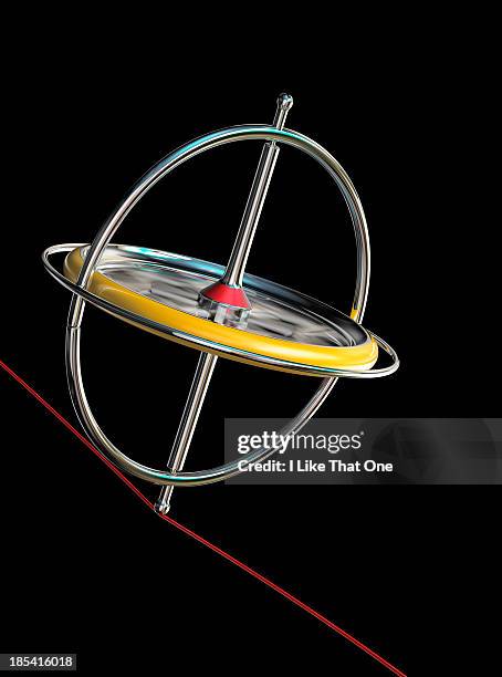 spinning gyroscope, balancing on a red cable - gyroscope stock pictures, royalty-free photos & images
