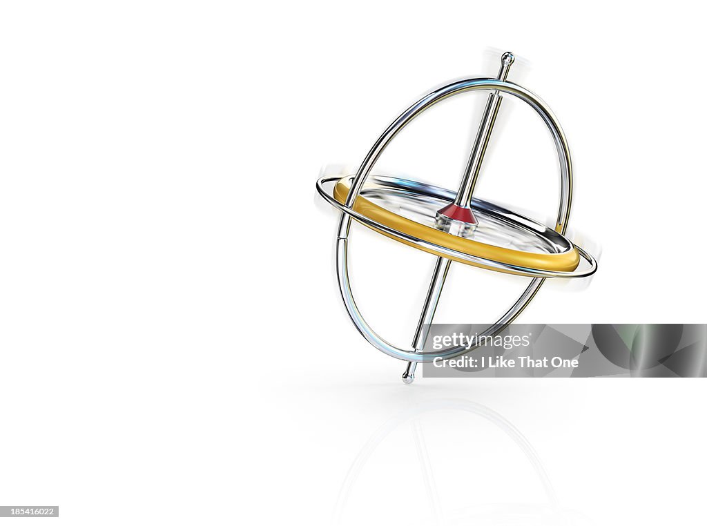 Spinning Gyroscope Balancing On Reflective Surface High-Res Stock Photo ...