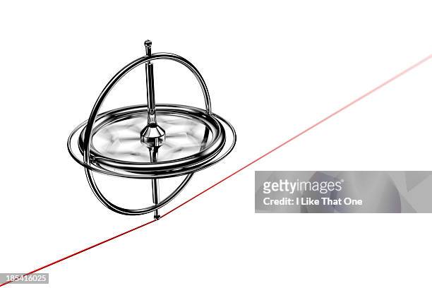 spinning gyroscope, balancing on a red cable - gyroscope stock-fotos und bilder