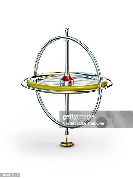 spinning gyroscope, balancing on drawing pin/tack - gyroscope stock pictures, royalty-free photos & images