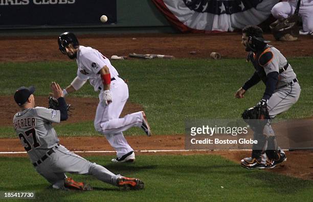 Detroit pitcher Max Scherzer catches a pop-up bunt by the Red Sox's Shane Victorino in the third inning of Game Six of the American League Champion...