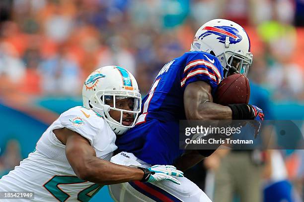 Graham of the Buffalo Bills is tackled by Dimitri Patterson of the Miami Dolphins at Sun Life Stadium on October 20, 2013 in Miami Gardens, Florida.