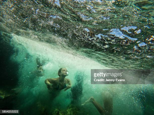 People swim underwater at Clovelly Beach on December 14, 2023 in Sydney, Australia. A severe heat wave hit Sydney over the weekend, a precursor of...