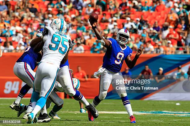 Thad Lewis of the Buffalo Bills throws the ball under pressure from Dion Jordan of the Miami Dolphins at Sun Life Stadium on October 20, 2013 in...