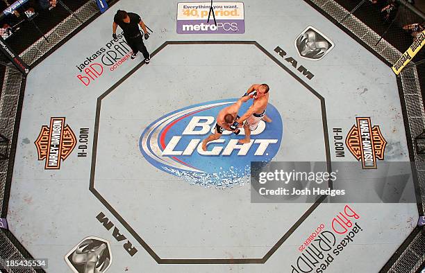 Junior Dos Santos punches Cain Velasquez in their UFC heavyweight championship bout at the Toyota Center on October 19, 2013 in Houston, Texas. Cain...