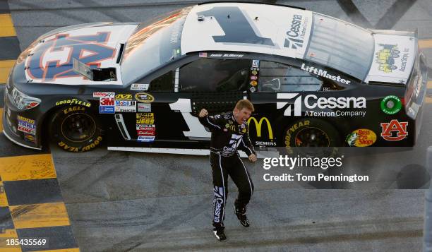 Jamie McMurray, driver of the Cessna Chevrolet, celebrates on track after winning the NASCAR Sprint Cup Series Camping World RV Sales 500 at...