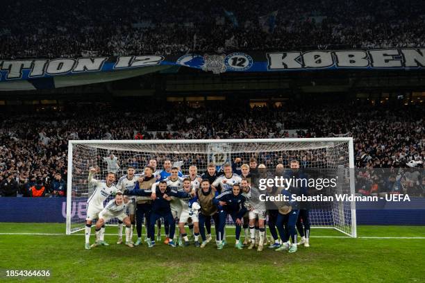 The team of F.C. Copenhagen pose for a photo in front of their fans after winning the the UEFA Champions League match between F.C. Copenhagen and...