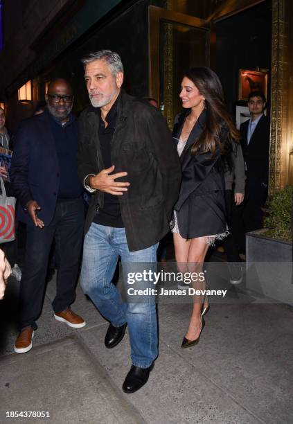 George Clooney and Amal Clooney leave the Polo Bar on December 14, 2023 in New York City.