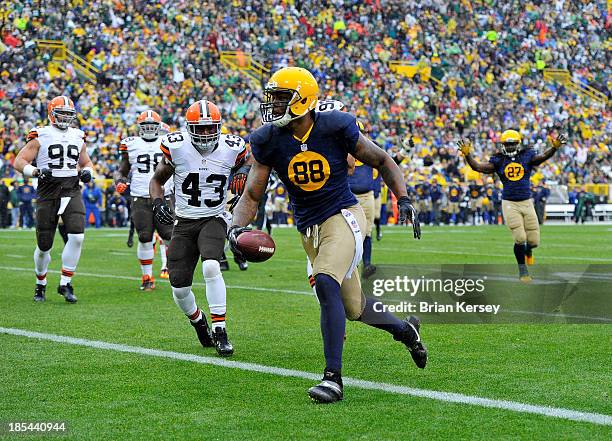 Jermichael Finley of the Green Bay Packers scores on a 10-yard touchdown reception during the first quarter against the Cleveland Browns at Lambeau...