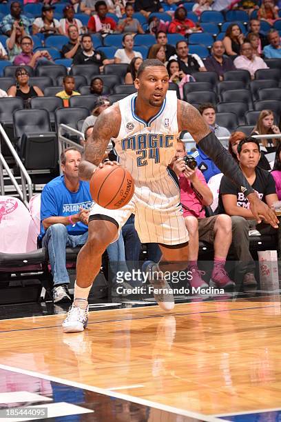Romero Osby of the Orlando Magic drives baseline against the Detroit Pistons during the game on October 20, 2013 at Amway Center in Orlando, Florida....