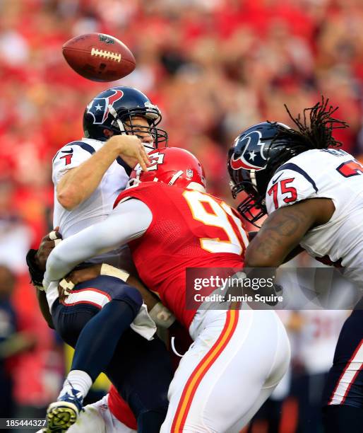 Quarterback Case Keenum of the Houston Texans loses the ball as he is sacked by outside linebacker Tamba Hali of the Kansas City Chiefs as tackle...