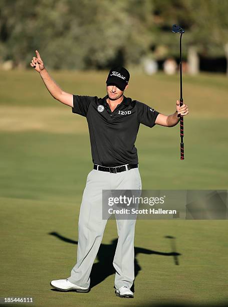 Webb Simpson celebrates after making birdie on the 18th hole on his way to a six-stroke victory during the final round of the Shriners Hospitals for...