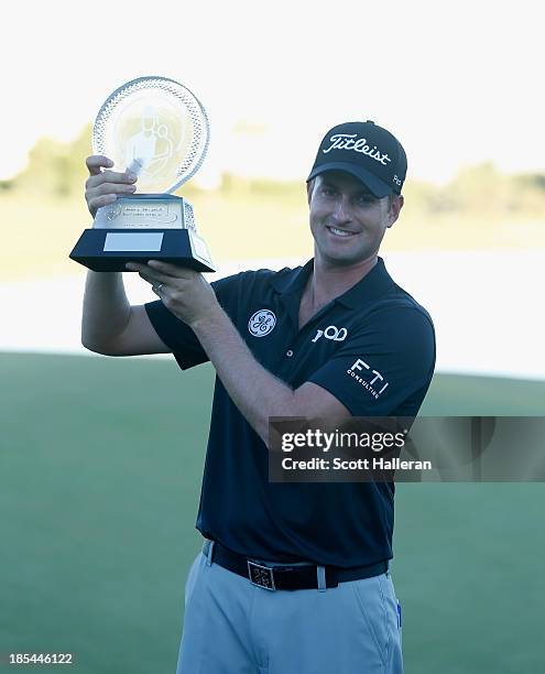Webb Simpson poses with the trophy after his six-stroke victory during the final round of the Shriners Hospitals for Children Open at TPC Summerlin...