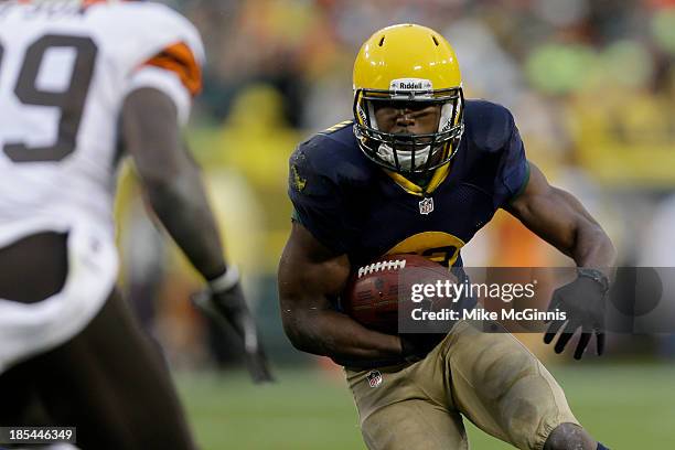 Johnathan Franklin of the Green Bay Packers runs with the football during the game against the Cleveland Browns at Lambeau Field on October 20, 2013...