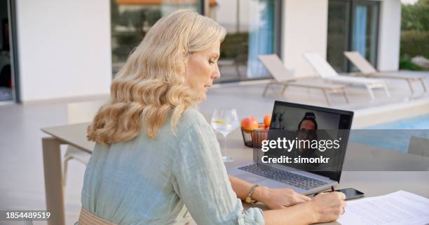 businesswoman with colleague during conference call - fruit bowl stock pictures, royalty-free photos & images