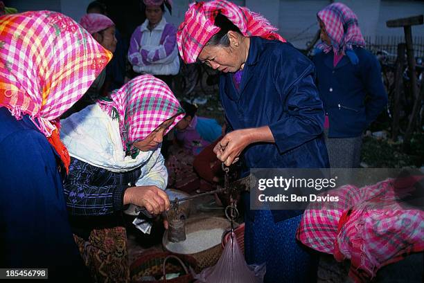 At dawn, ethnic minorities and hill tribes from the remote northern region of Luang Namtha walk to the popular daily market of Talat Nyai in Muang...